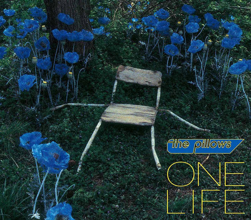 the pillows ONE LIFE single cover art. It features a chair with broken legs surrounded by blue flowers.